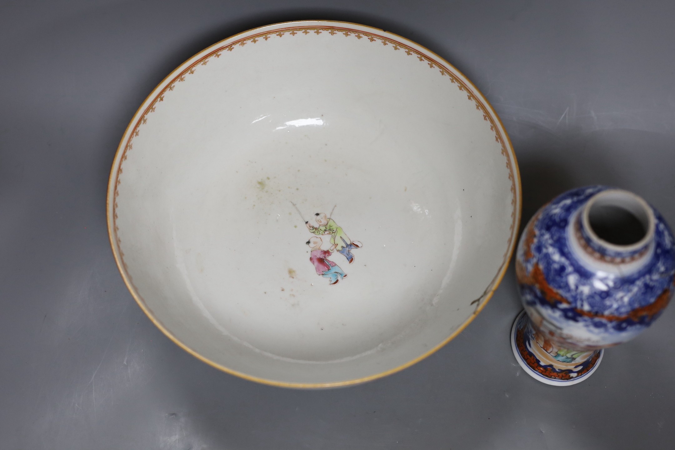 An 18th century Chinese export famille rose bowl and a similar mandarin pattern vase, bowl 26cm diameter